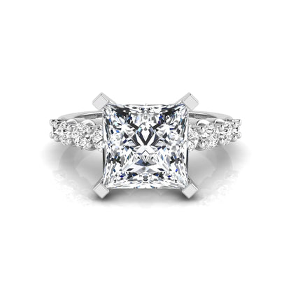 Princess cut lab grown diamond engagement ring with round side diamonds in white gold.