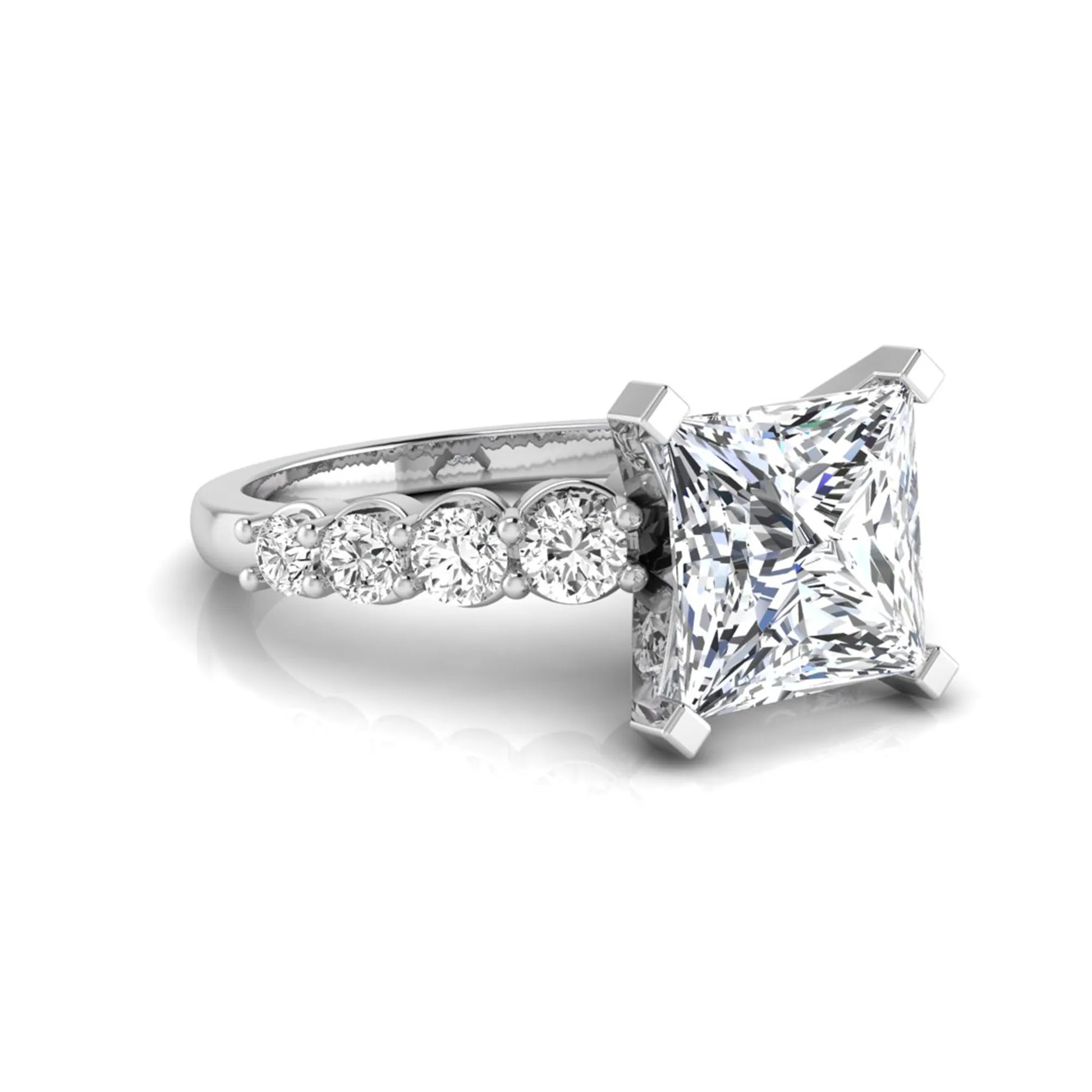 Princess cut lab grown diamond engagement ring with round side diamonds in white gold.
