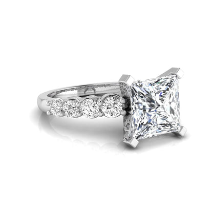 Princess cut lab grown diamond engagement ring with round side diamonds in white gold.