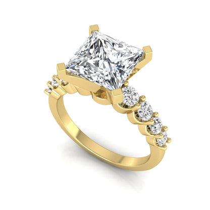 Princess cut lab grown diamond engagement ring with round side diamonds in yellow gold.