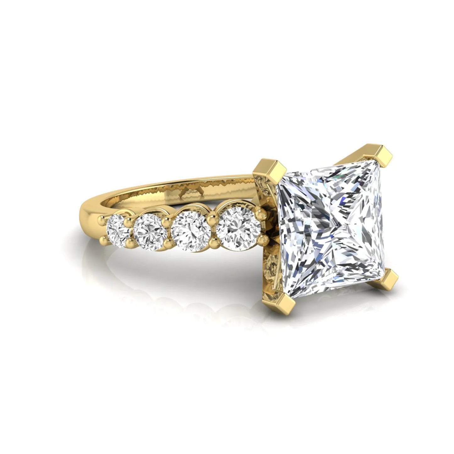 Princess cut lab grown diamond engagement ring with round side diamonds in yellow gold.