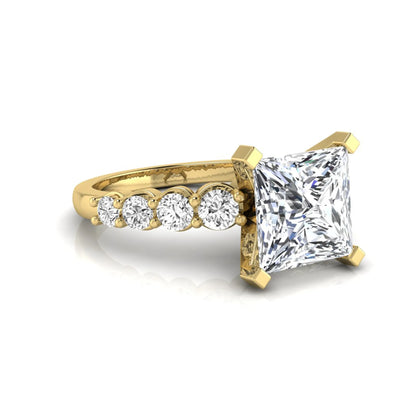 Princess cut lab grown diamond engagement ring with round side diamonds in yellow gold.