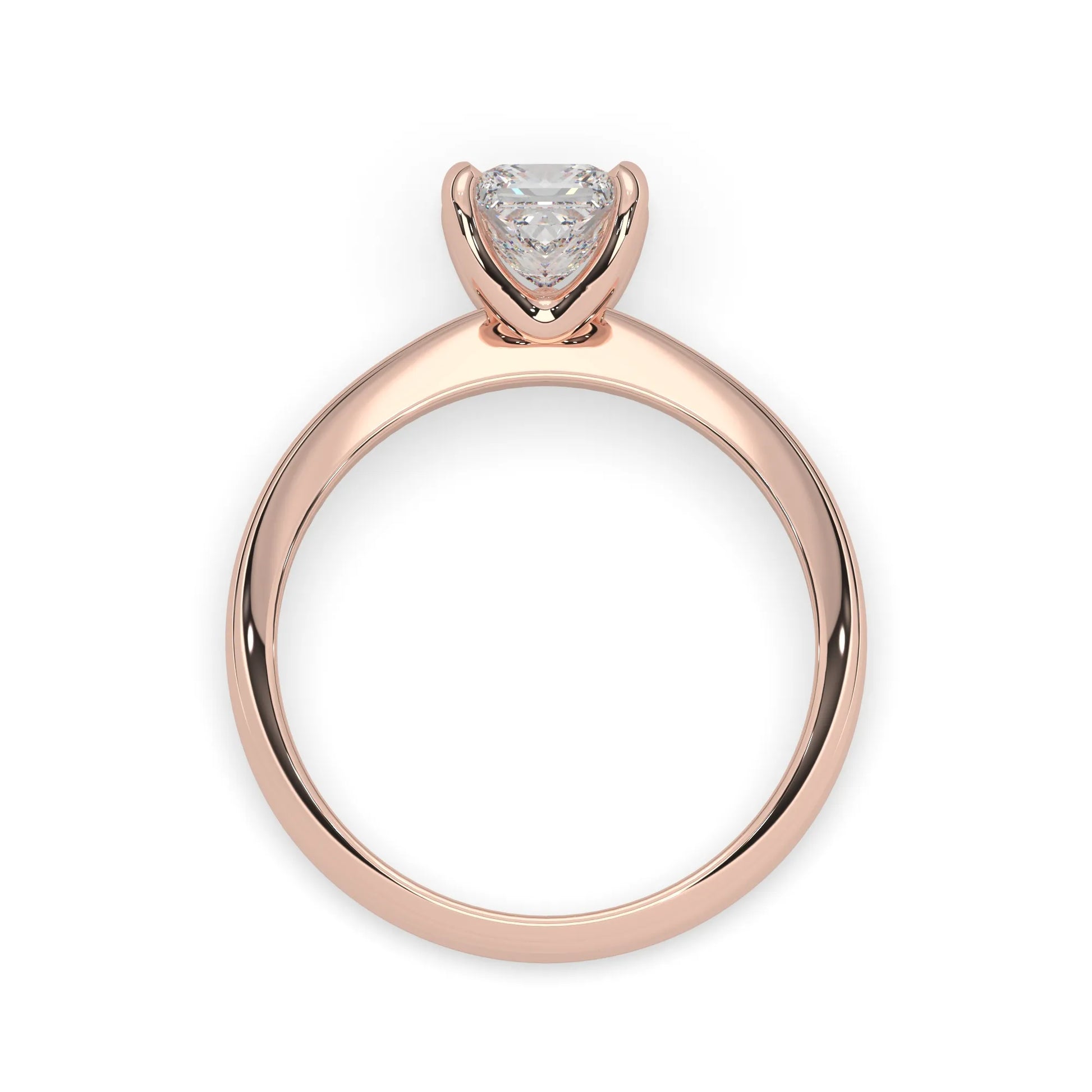 Rose-gold ring with a heart-shaped diamond on a white background