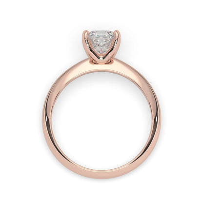 Rose-gold ring with a heart-shaped diamond on a white background