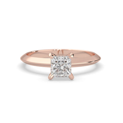 rose-gold ring with a diamond on a white background