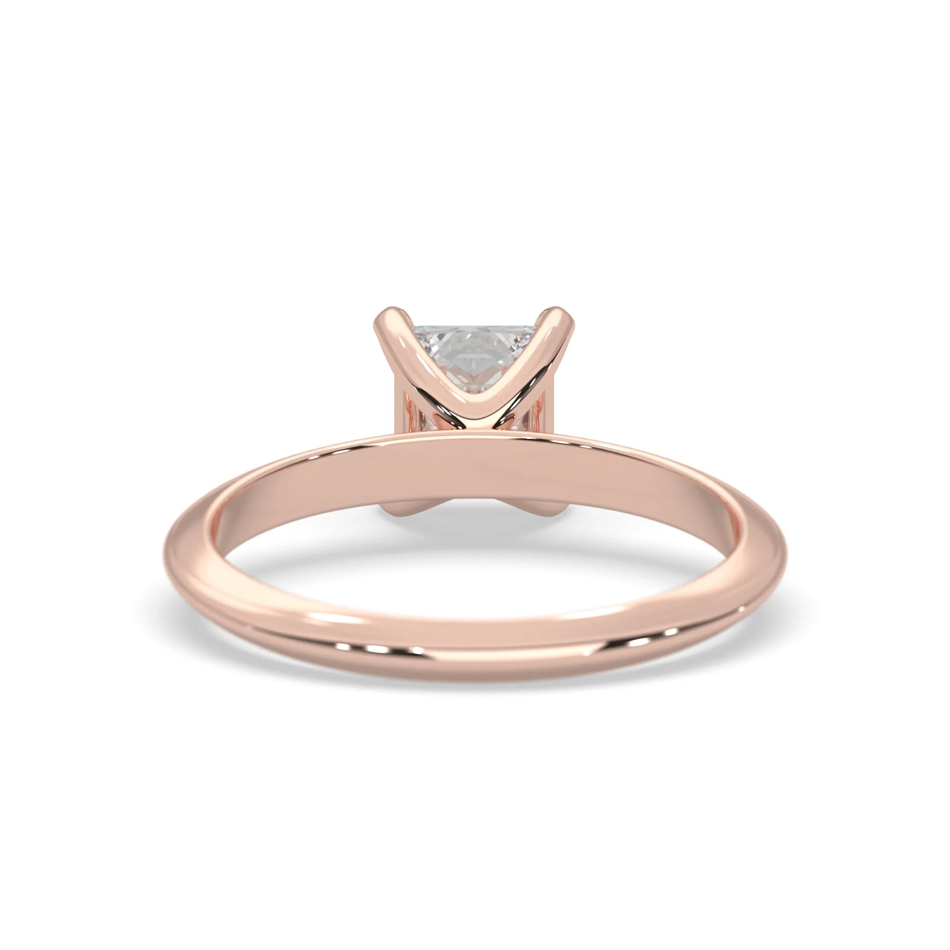 Rose-gold ring with a diamond on a white background