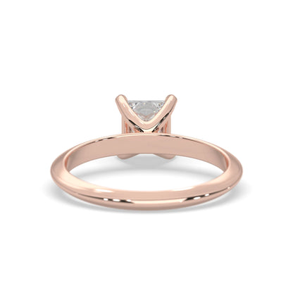 Rose-gold ring with a diamond on a white background