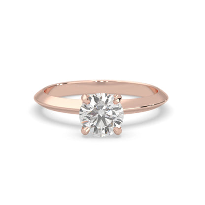 Rose-gold ring with a diamond on a white background