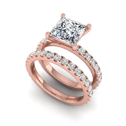 Princess Cut Solitaire Pavé Bridal Ring Set featuring a 7.00 mm IGI Certified lab grown diamond with matching round diamond pavé engagement ring and wedding band in rose gold
