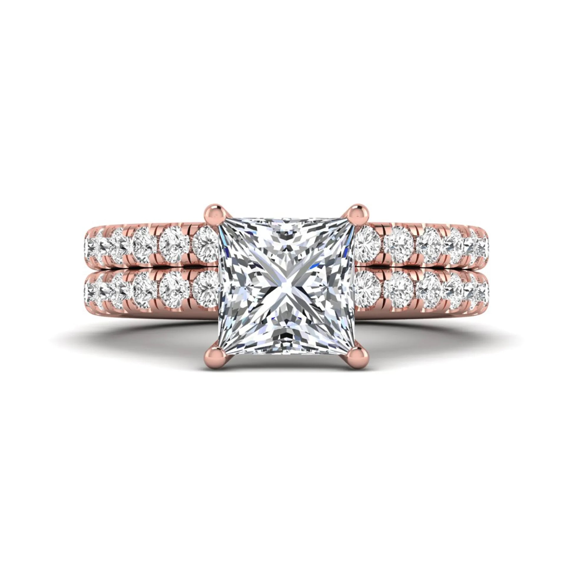 Princess Cut Solitaire Pavé Bridal Ring Set featuring a 7.00 mm IGI Certified lab grown diamond with matching round diamond pavé engagement ring and wedding band in rose gold