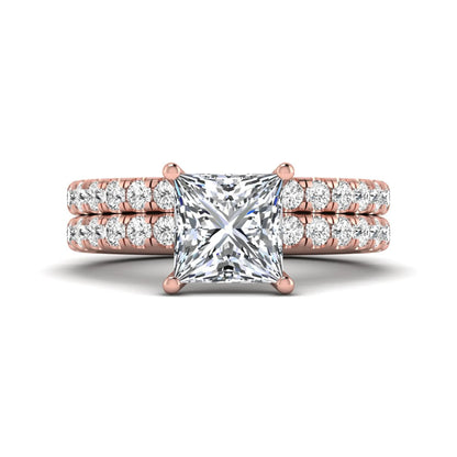 Princess Cut Solitaire Pavé Bridal Ring Set featuring a 7.00 mm IGI Certified lab grown diamond with matching round diamond pavé engagement ring and wedding band in rose gold