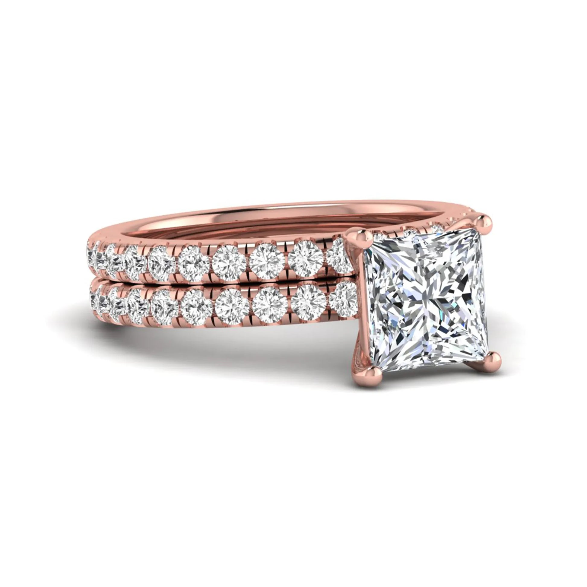 Princess Cut Solitaire Pavé Bridal Ring Set featuring a 7.00 mm IGI Certified lab grown diamond with matching round diamond pavé engagement ring and wedding band in rose gold