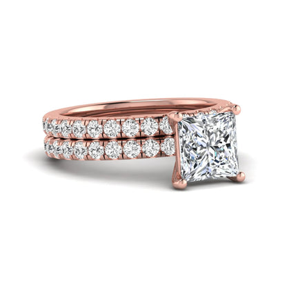 Princess Cut Solitaire Pavé Bridal Ring Set featuring a 7.00 mm IGI Certified lab grown diamond with matching round diamond pavé engagement ring and wedding band in rose gold