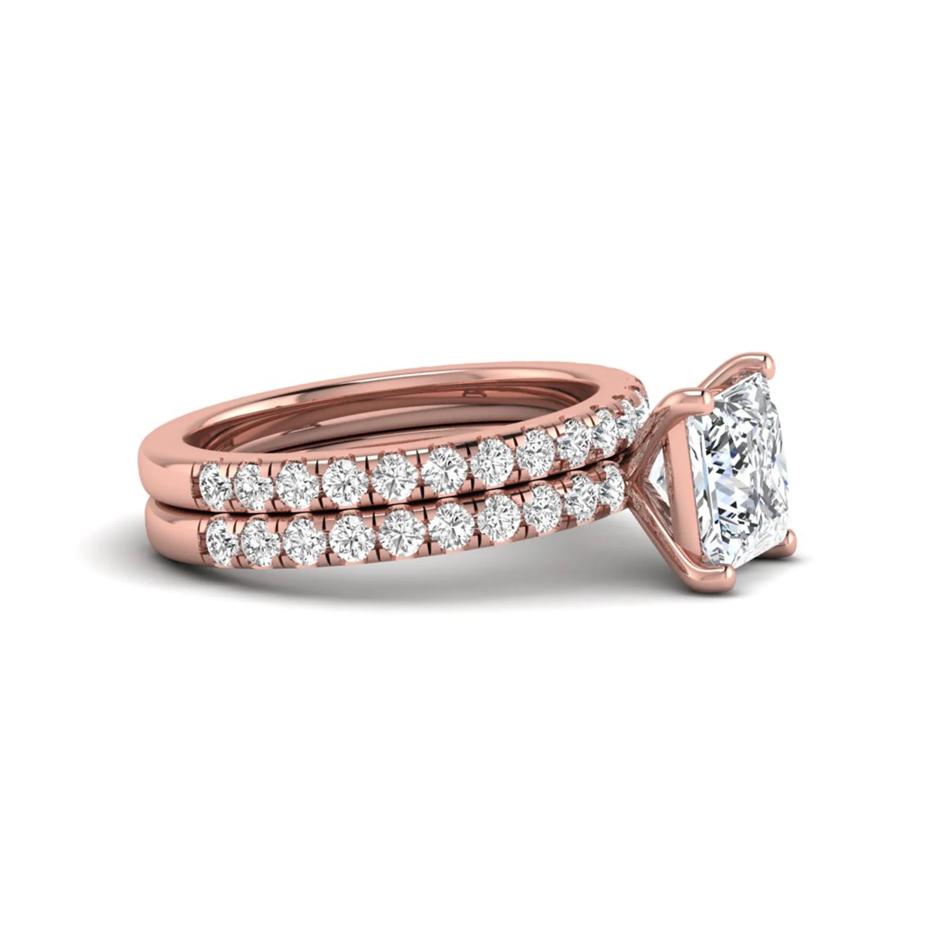 Princess Cut Solitaire Pavé Bridal Ring Set featuring a 7.00 mm IGI Certified lab grown diamond with matching round diamond pavé engagement ring and wedding band in rose gold