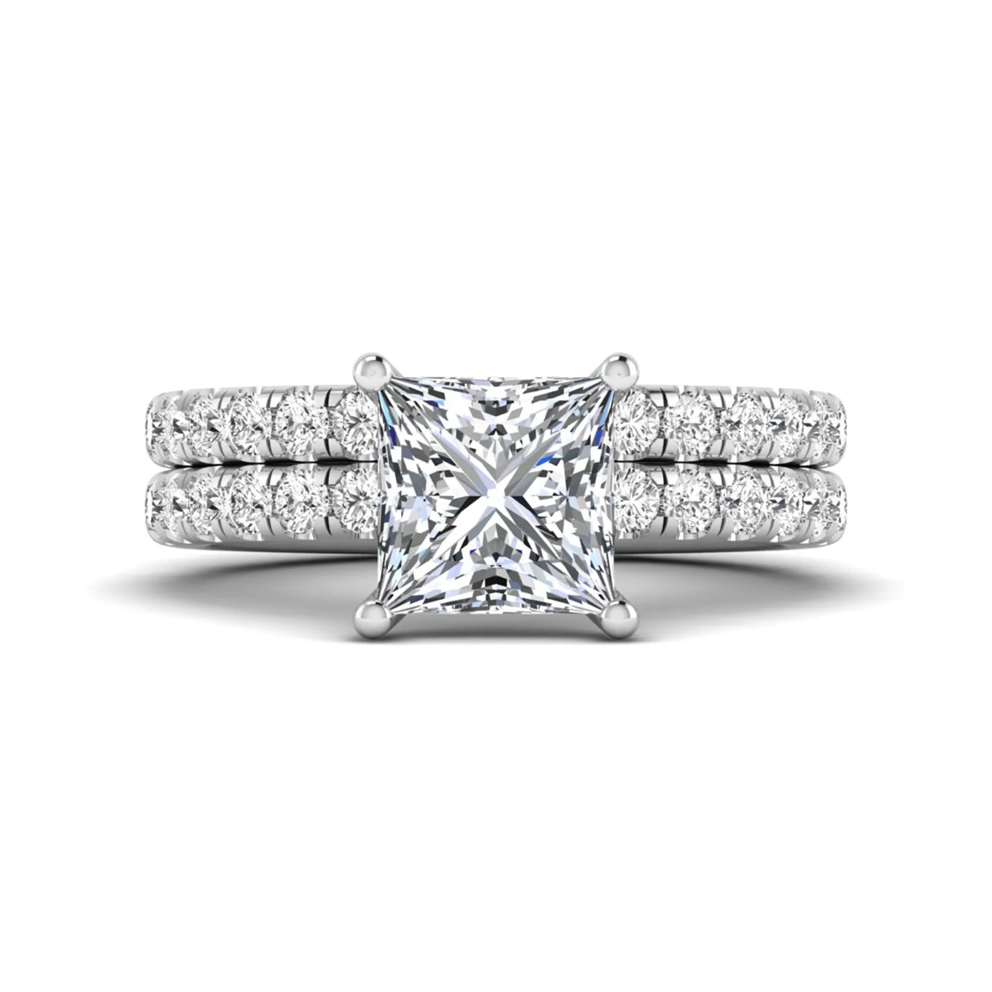 Princess Cut Solitaire Pavé Bridal Ring Set featuring a 7.00 mm IGI Certified lab grown diamond with matching round diamond pavé engagement ring and wedding band in white gold