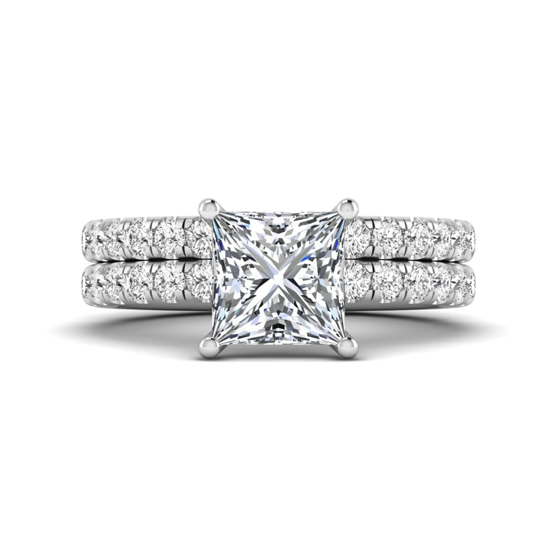 Princess Cut Solitaire Pavé Bridal Ring Set featuring a 7.00 mm IGI Certified lab grown diamond with matching round diamond pavé engagement ring and wedding band in white gold
