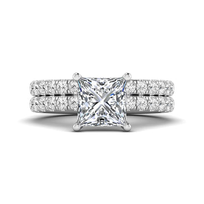 Princess Cut Solitaire Pavé Bridal Ring Set featuring a 7.00 mm IGI Certified lab grown diamond with matching round diamond pavé engagement ring and wedding band in white gold