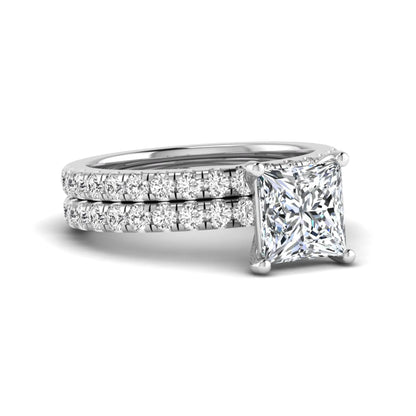 Princess Cut Solitaire Pavé Bridal Ring Set featuring a 7.00 mm IGI Certified lab grown diamond with matching round diamond pavé engagement ring and wedding band in white gold