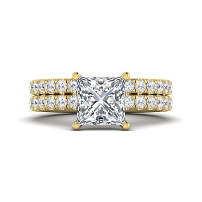 Princess Cut Solitaire Pavé Bridal Ring Set featuring a 7.00 mm IGI Certified lab grown diamond with matching round diamond pavé engagement ring and wedding band in yellow gold