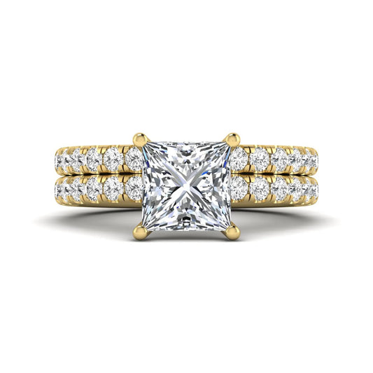 Princess Cut Solitaire Pavé Bridal Ring Set featuring a 7.00 mm IGI Certified lab grown diamond with matching round diamond pavé engagement ring and wedding band in yellow gold