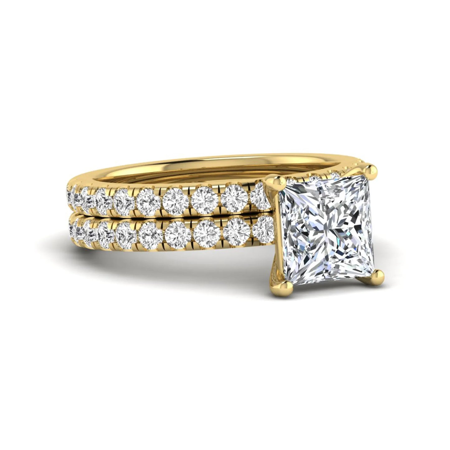 Princess Cut Solitaire Pavé Bridal Ring Set featuring a 7.00 mm IGI Certified lab grown diamond with matching round diamond pavé engagement ring and wedding band in yellow gold