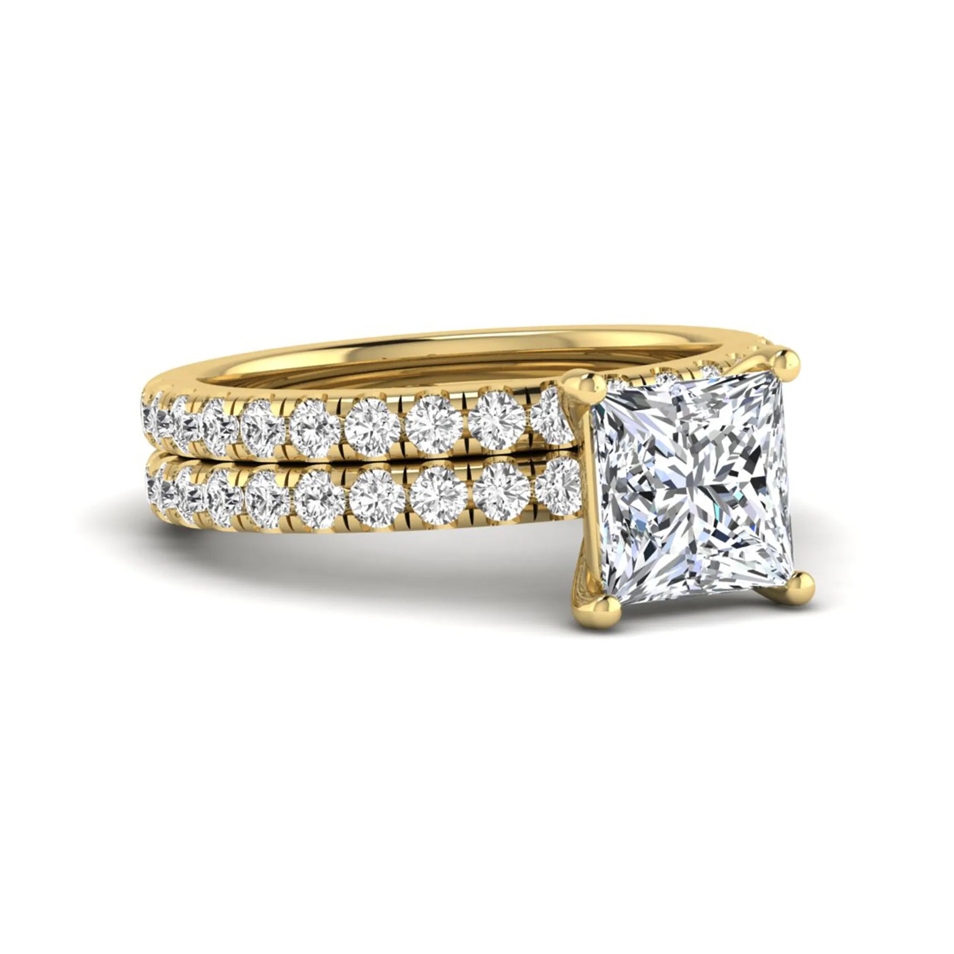 Princess Cut Solitaire Pavé Bridal Ring Set featuring a 7.00 mm IGI Certified lab grown diamond with matching round diamond pavé engagement ring and wedding band in yellow gold