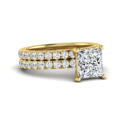 Princess Cut Solitaire Pavé Bridal Ring Set featuring a 7.00 mm IGI Certified lab grown diamond with matching round diamond pavé engagement ring and wedding band in yellow gold