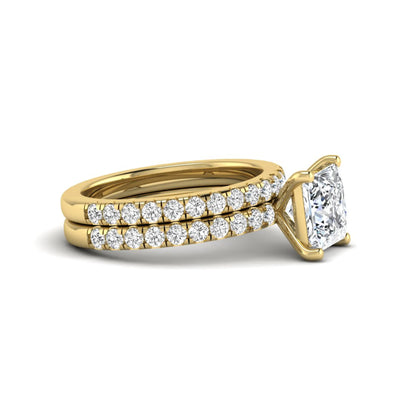 Princess Cut Solitaire Pavé Bridal Ring Set featuring a 7.00 mm IGI Certified lab grown diamond with matching round diamond pavé engagement ring and wedding band in yellow gold
