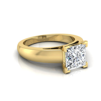Princess cut four prong lab grown diamond solitaire engagement ring with a yellow gold tone band featuring an IGI certified center diamond.
