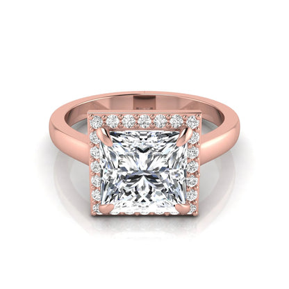 Princess cut lab grown diamond engagement ring featuring an IGI certified center diamond surrounded by a round diamond halo in a classic four-prong setting in rose gold