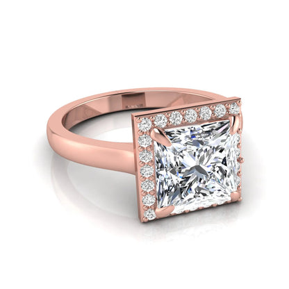 Princess cut lab grown diamond engagement ring featuring an IGI certified center diamond surrounded by a round diamond halo in a classic four-prong setting in rose gold