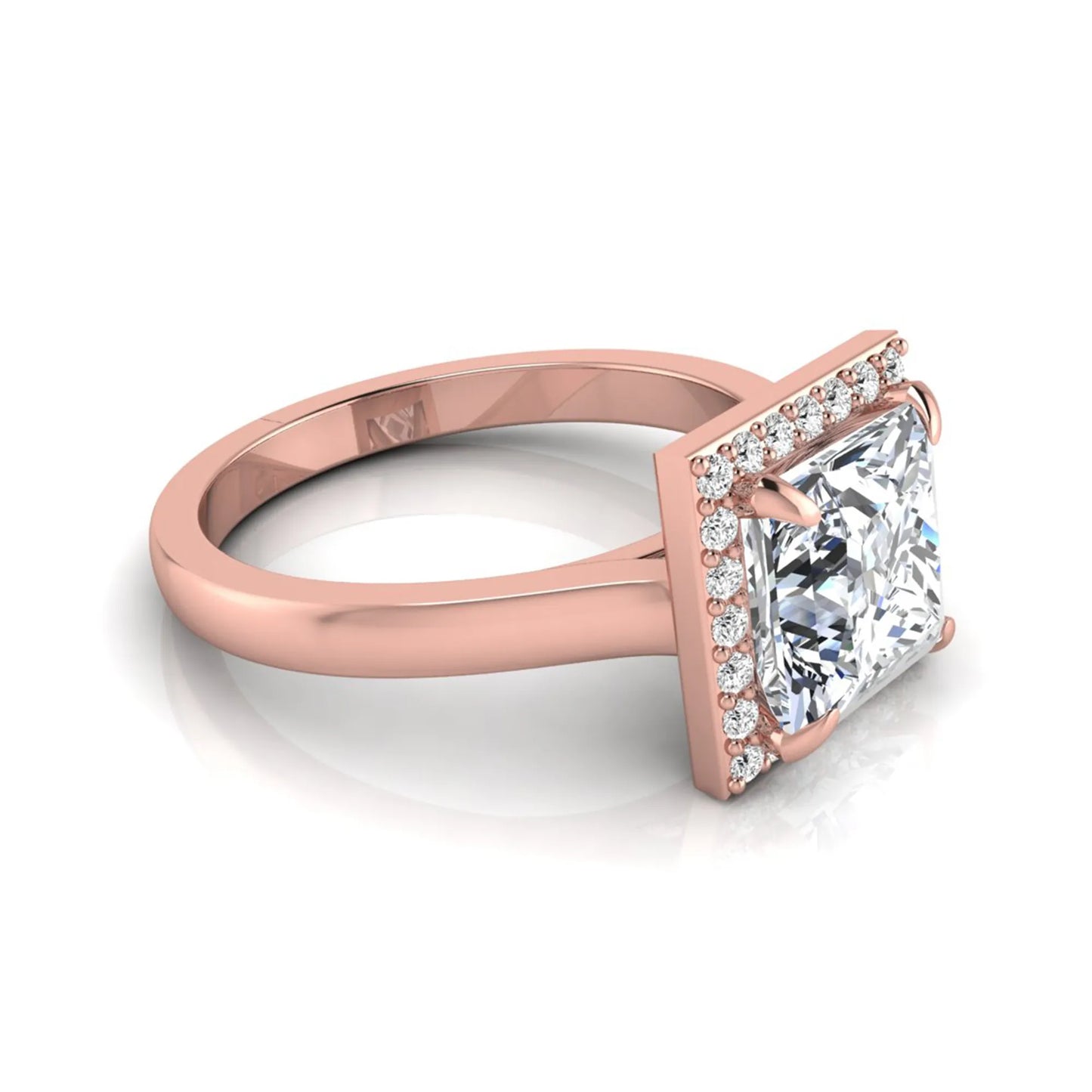 Princess cut lab grown diamond engagement ring featuring an IGI certified center diamond surrounded by a round diamond halo in a classic four-prong setting in rose gold