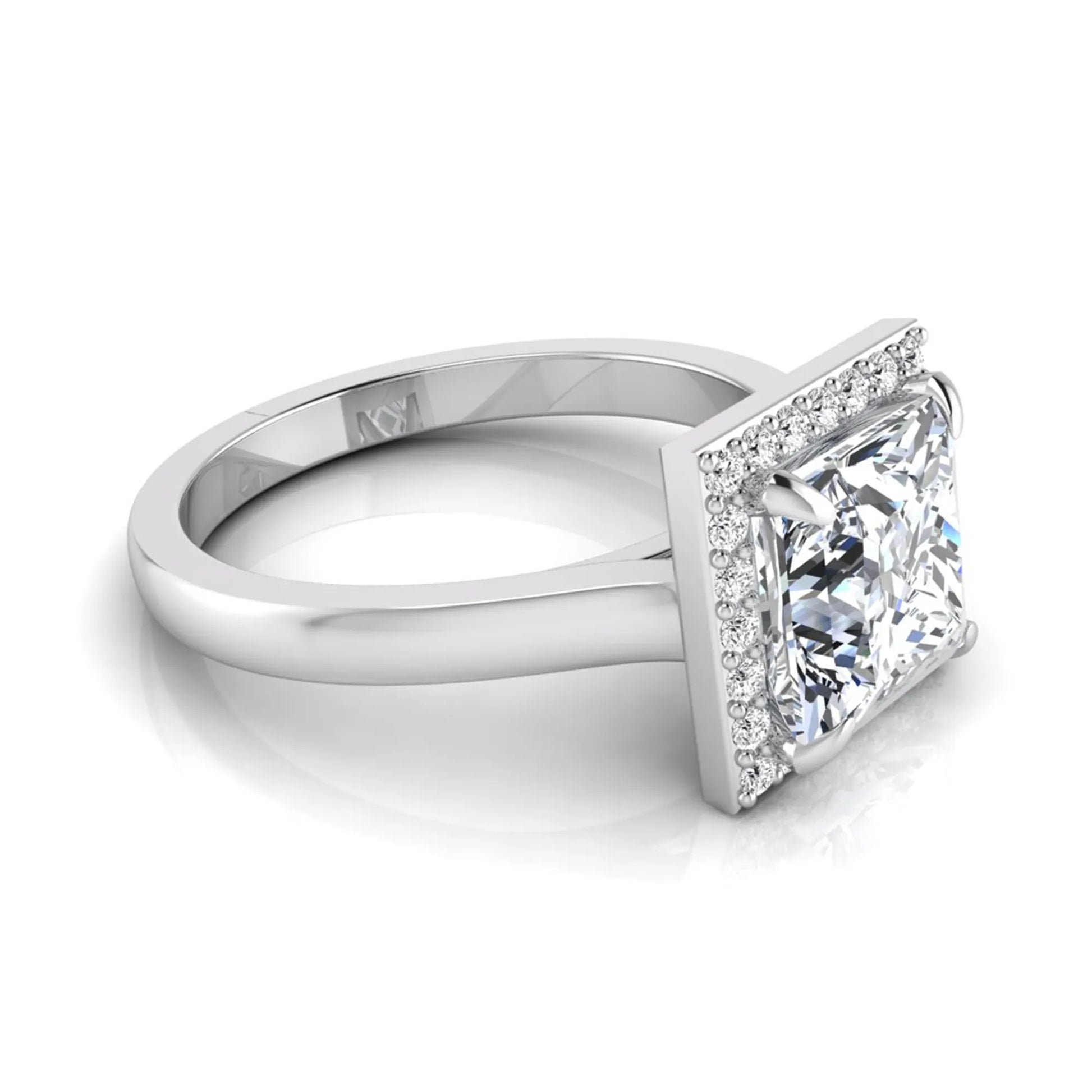 Princess cut lab grown diamond engagement ring featuring an IGI certified center diamond surrounded by a round diamond halo in a classic four-prong setting in white gold