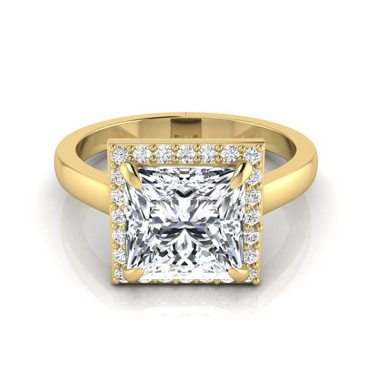Princess cut lab grown diamond engagement ring featuring an IGI certified center diamond surrounded by a round diamond halo in a classic four-prong setting in yellow gold