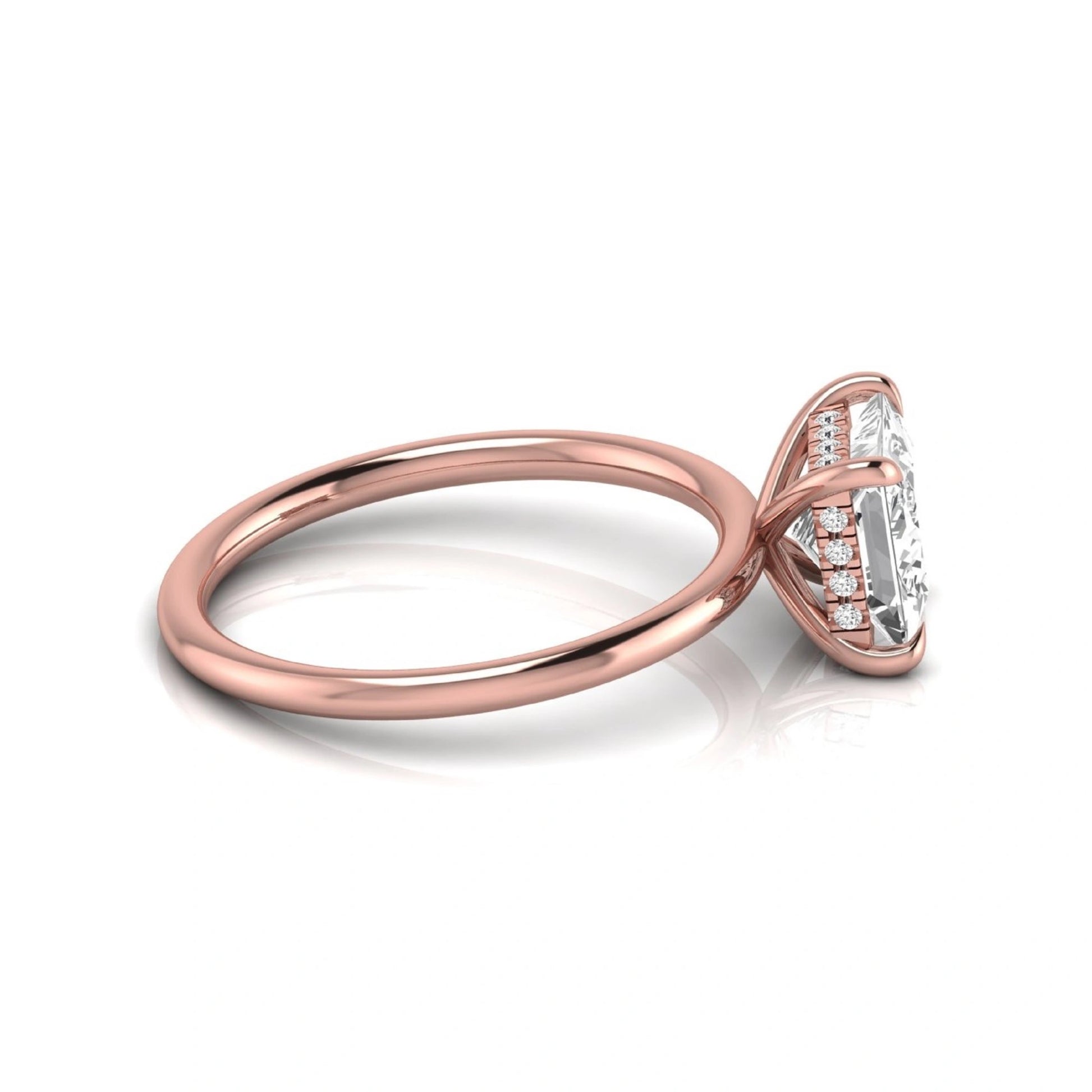 Princess cut lab grown diamond hidden halo solitaire engagement ring with a four-prong setting and rose gold tone band.