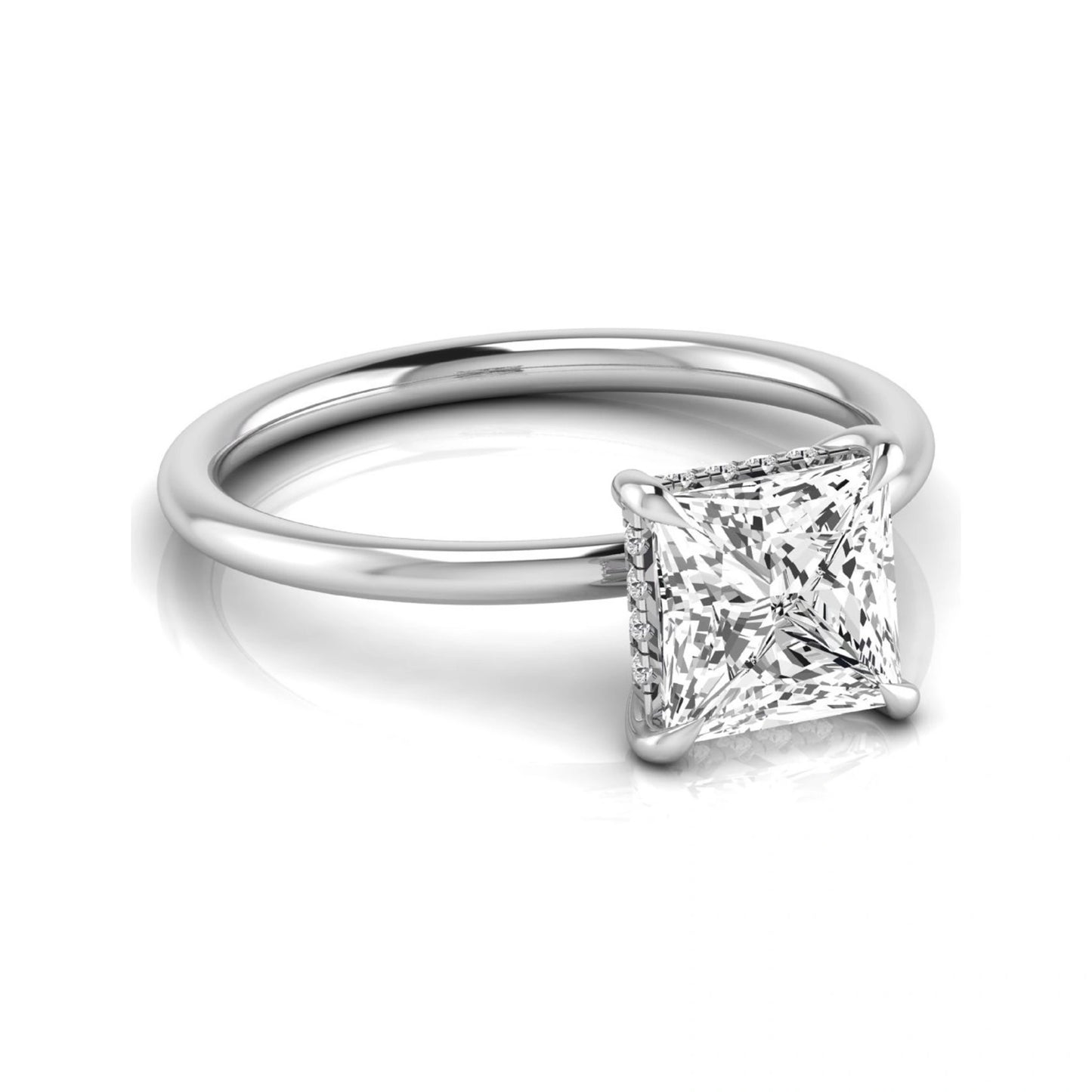 Princess cut lab grown diamond hidden halo solitaire engagement ring with a four-prong setting and white gold tone band.
