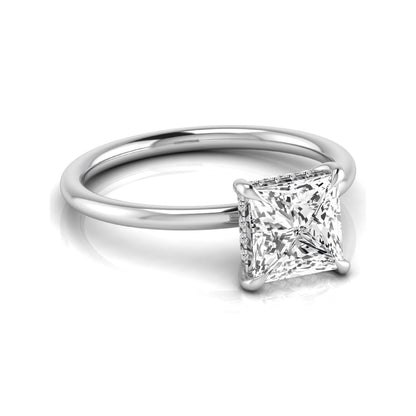 Princess cut lab grown diamond hidden halo solitaire engagement ring with a four-prong setting and white gold tone band.