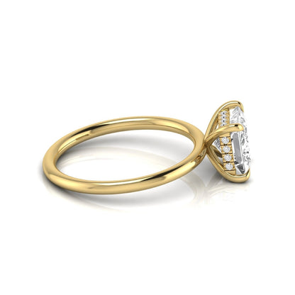Princess cut lab grown diamond hidden halo solitaire engagement ring with a four-prong setting and yellow gold tone band.