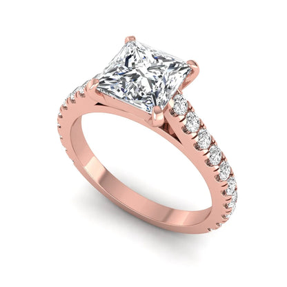 Princess cut lab grown diamond engagement ring with pavé round diamonds in a rose gold four-prong setting