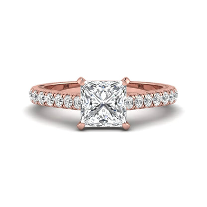 Princess cut lab grown diamond engagement ring with pavé round diamonds in a rose gold four-prong setting