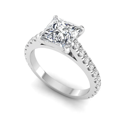 Princess cut lab grown diamond engagement ring with pavé round diamonds in a white gold four-prong setting