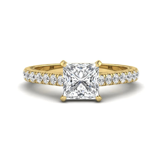 Princess cut lab grown diamond engagement ring with pavé round diamonds in a yellow gold four-prong setting