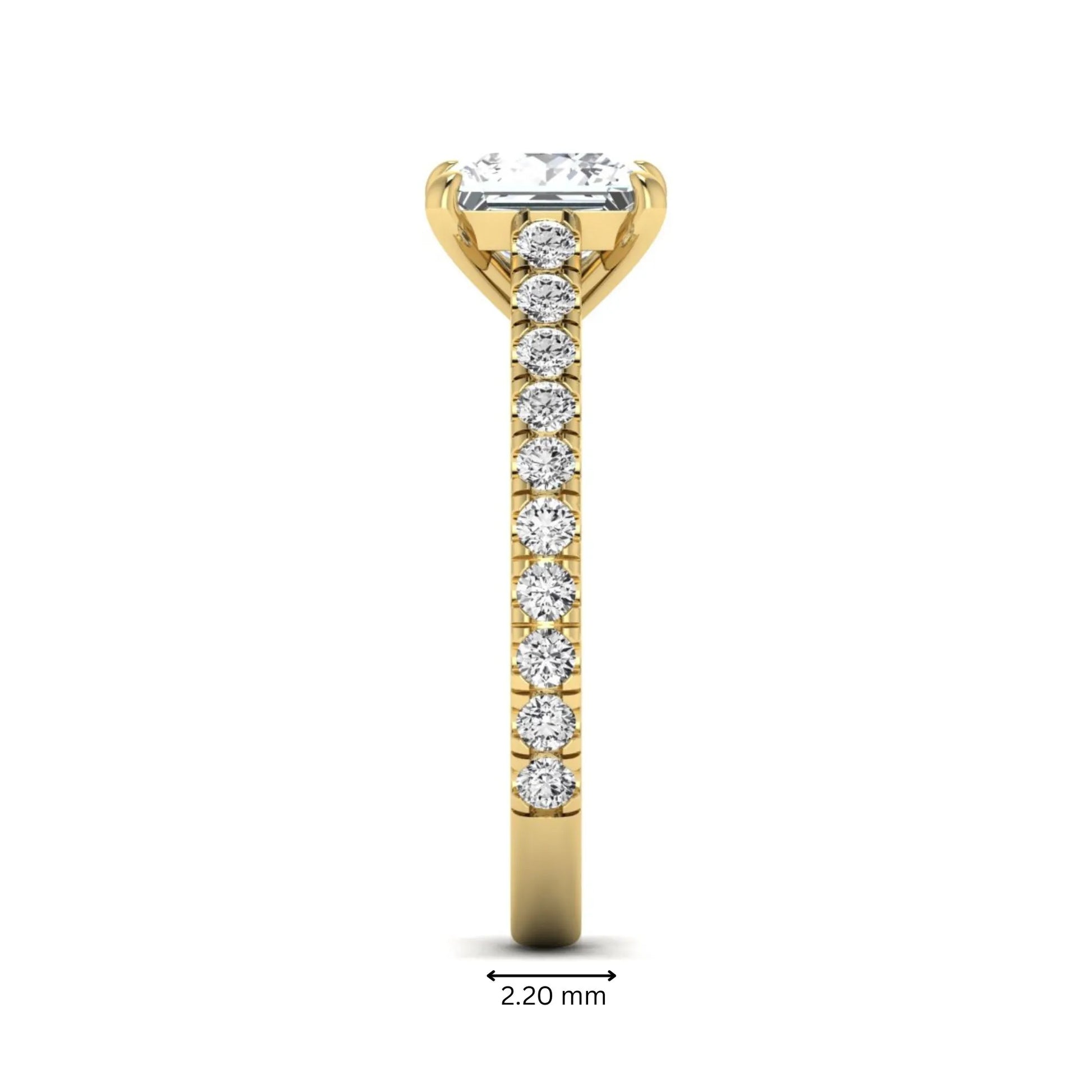 Princess cut lab grown diamond engagement ring with pavé round diamonds in a yellow gold four-prong setting