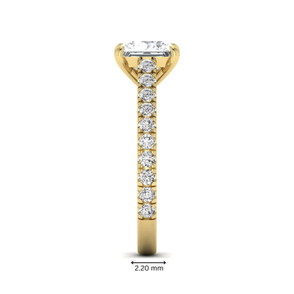Princess cut lab grown diamond engagement ring with pavé round diamonds in a yellow gold four-prong setting
