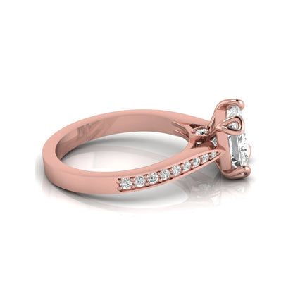 Princess cut lab grown diamond solitaire engagement ring featuring a four-prong setting with a pavé diamond band in rose gold tone.
