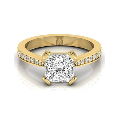 Princess cut lab grown diamond solitaire engagement ring featuring a four-prong setting with a pavé diamond band in yellow gold tone.