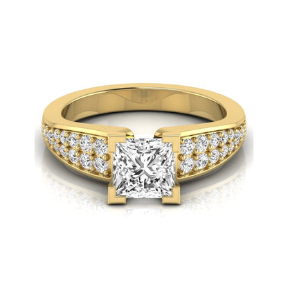 Princess cut lab grown diamond engagement ring with round side accent diamonds and four-prong setting in yellow gold style.