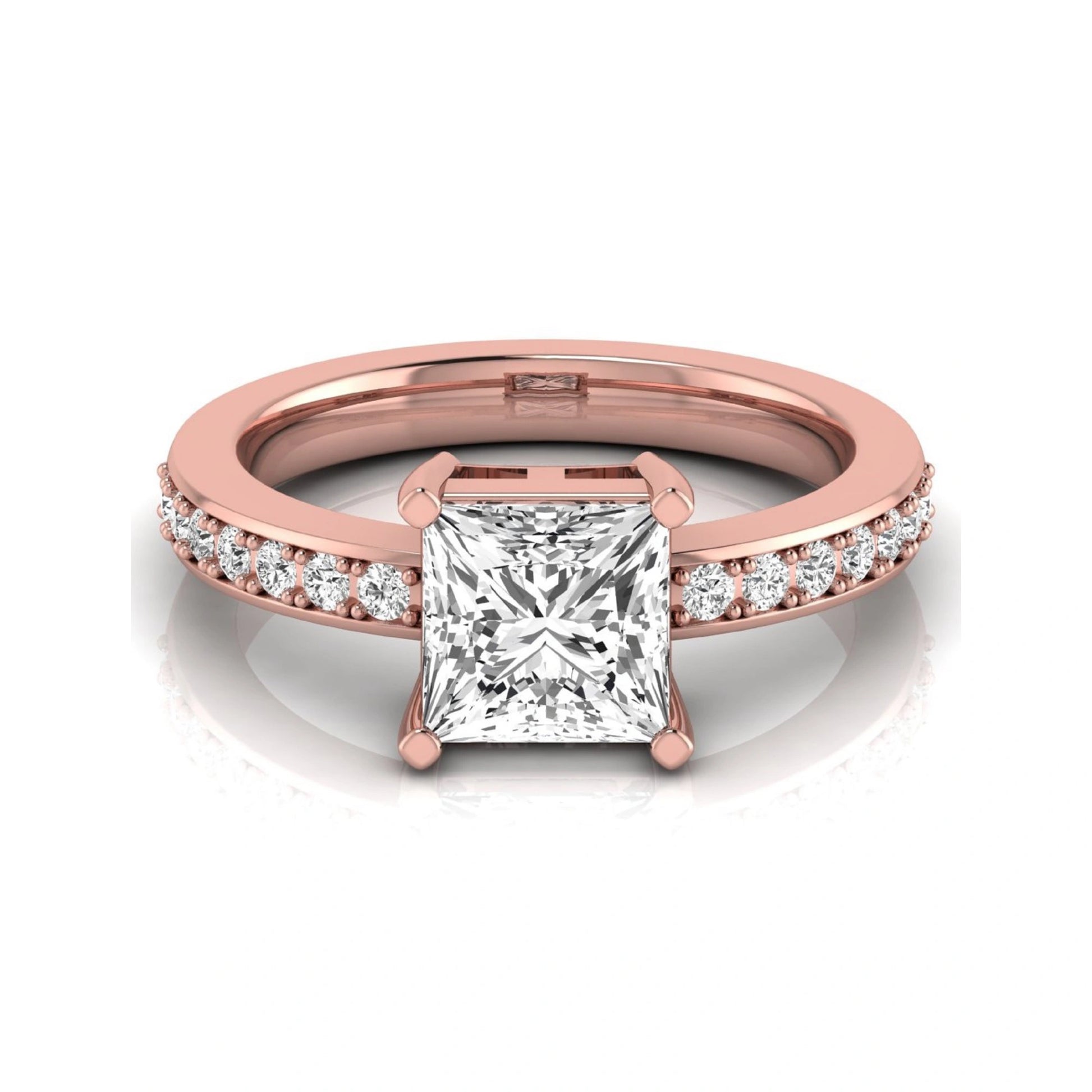 Princess cut lab grown diamond engagement ring featuring a four-prong solitaire setting with a pavé accent band and polished rose gold tone finish.