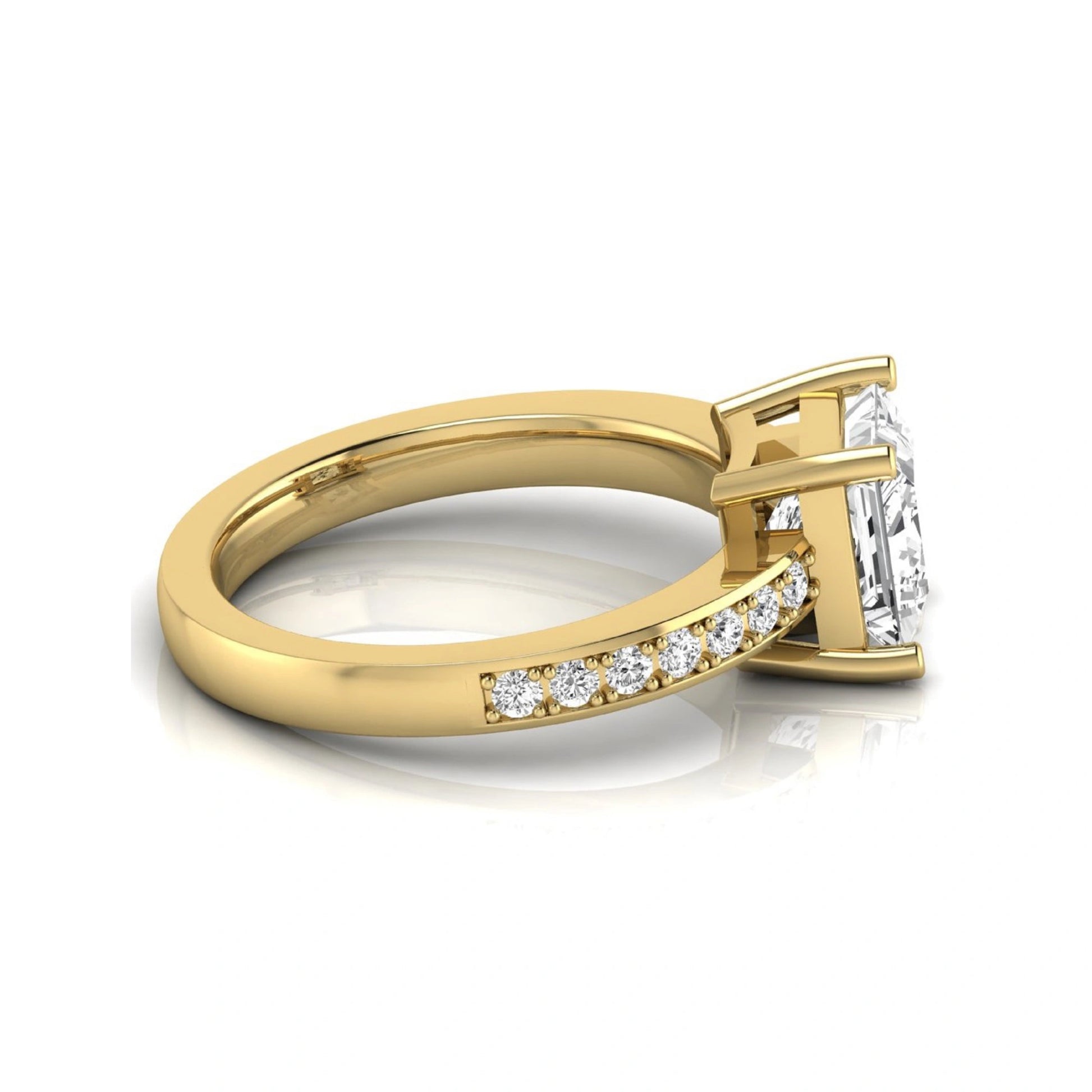 Princess cut lab grown diamond engagement ring featuring a four-prong solitaire setting with a pavé accent band and polished yellow gold tone finish.
