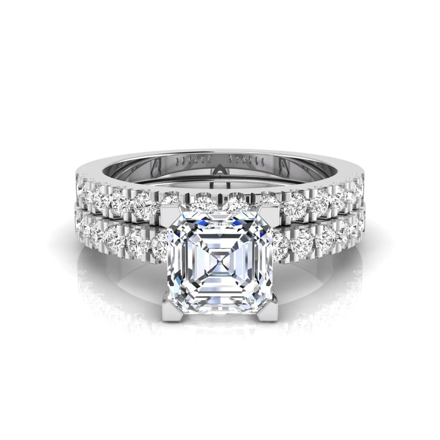 Princess cut lab grown diamond solitaire bridal ring set featuring a four-prong engagement ring with a matching pavé diamond wedding band in white gold.